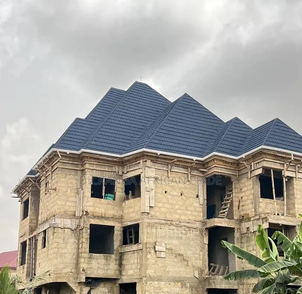 Roofed to Perfection by Dickanga Roofing Design · Photo 1