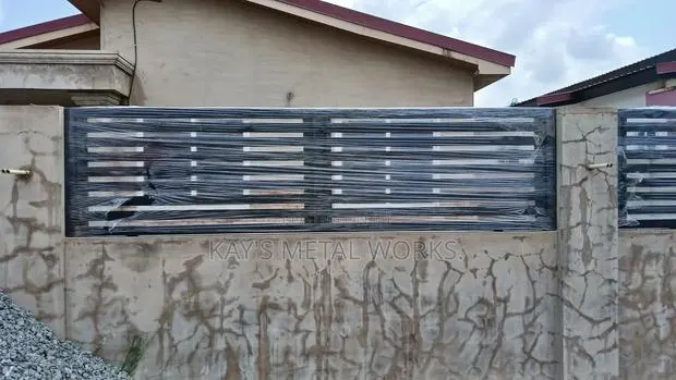 Modern Galvanized Metal Fence Wall Design | Strong Durable · Photo 1