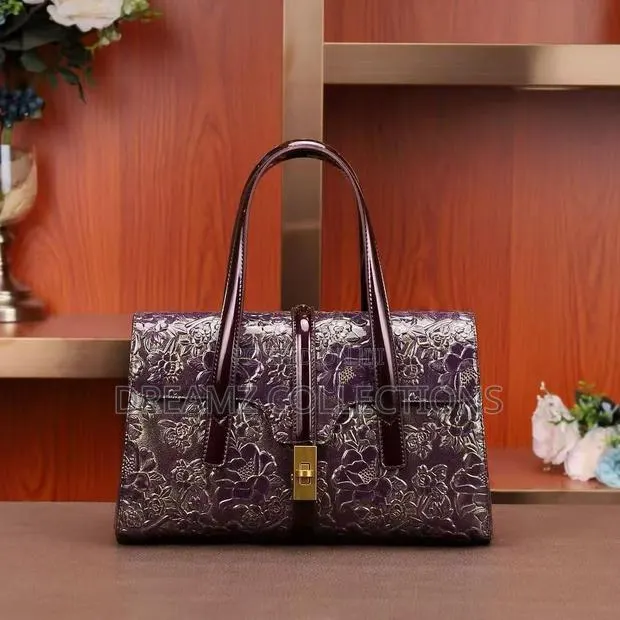 Embossed Floral Leather Handbag · Photo 1