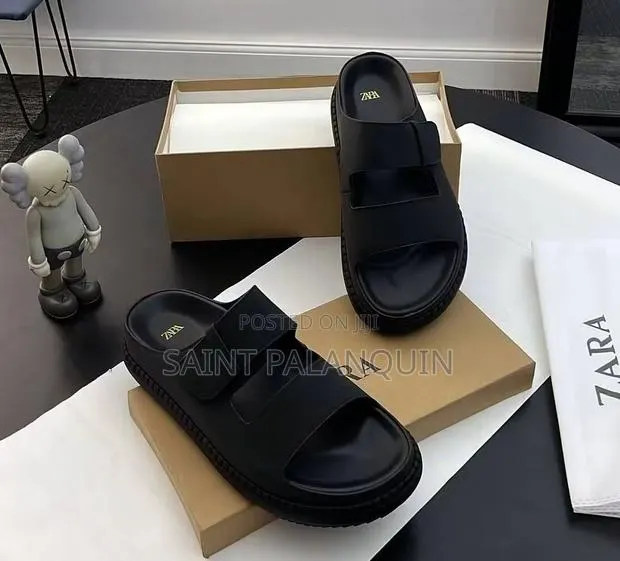 A Pair of Tan Men's Dual-Strap Leather Sandals · Photo 1