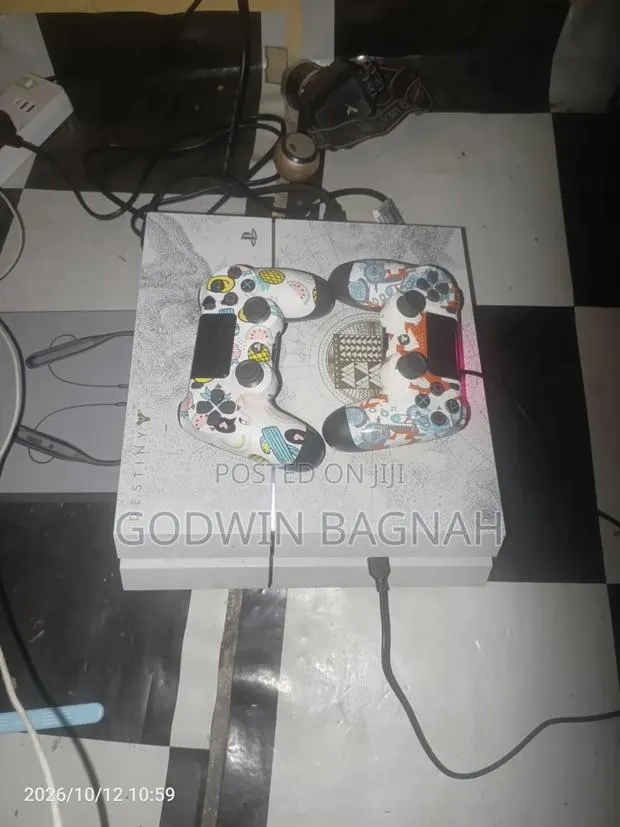 P S 4 With Two Controllers · Photo 1