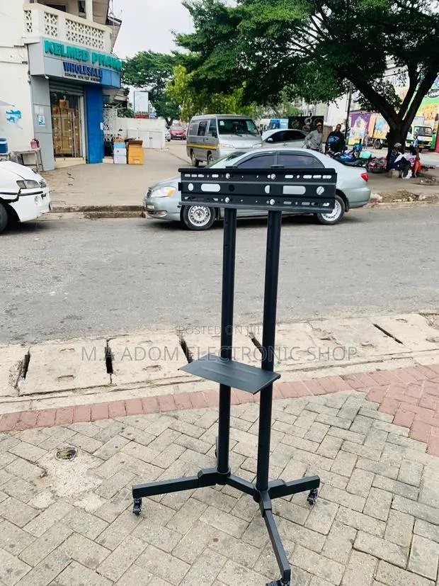 Affordable Mobile Tv Stand With Wheels for 32” to 70” Tv. · Photo 1