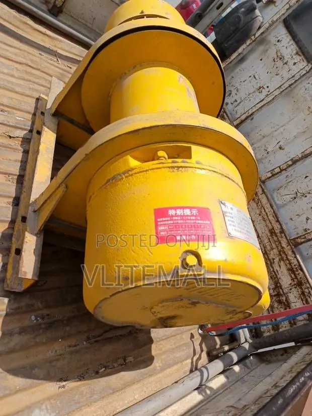 Heavy-Duty Yellow Electric Winch or Hoist Motor · Photo 4