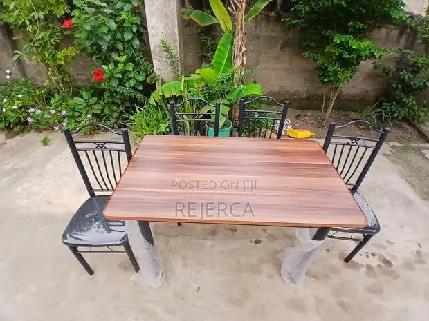 Durable Dinning Table With 4 Chairs · Photo 1
