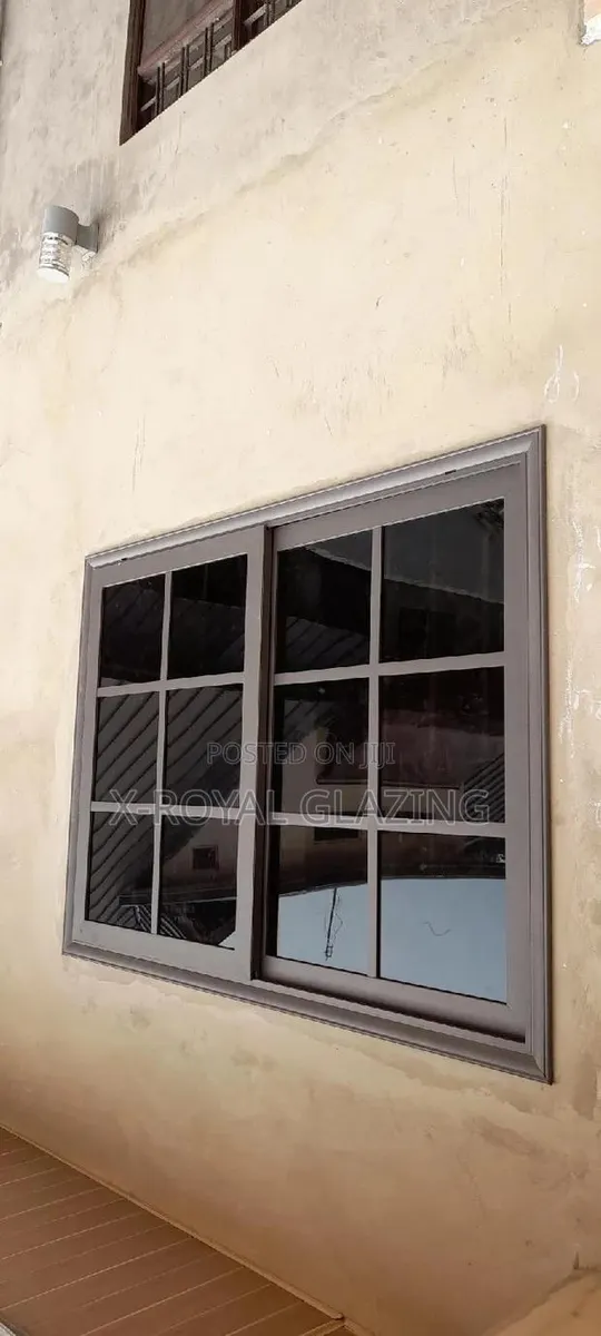 Gray Powdered Divisions Sliding Windows With Dark Glass · Photo 1