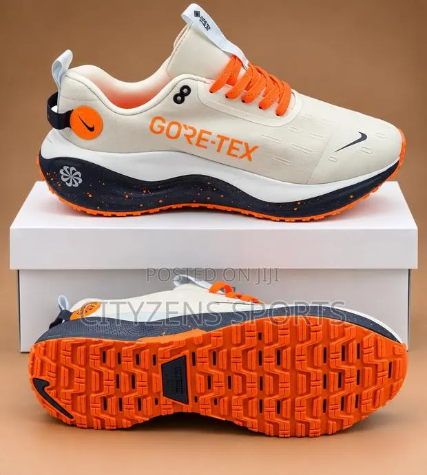 Nike Off White and Orange Trainers · Photo 1