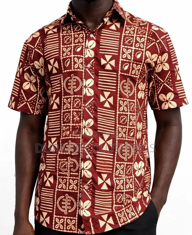 Handcrafted Short-Sleeve Shirt With Geometric Adinkra Symbols · Photo 1