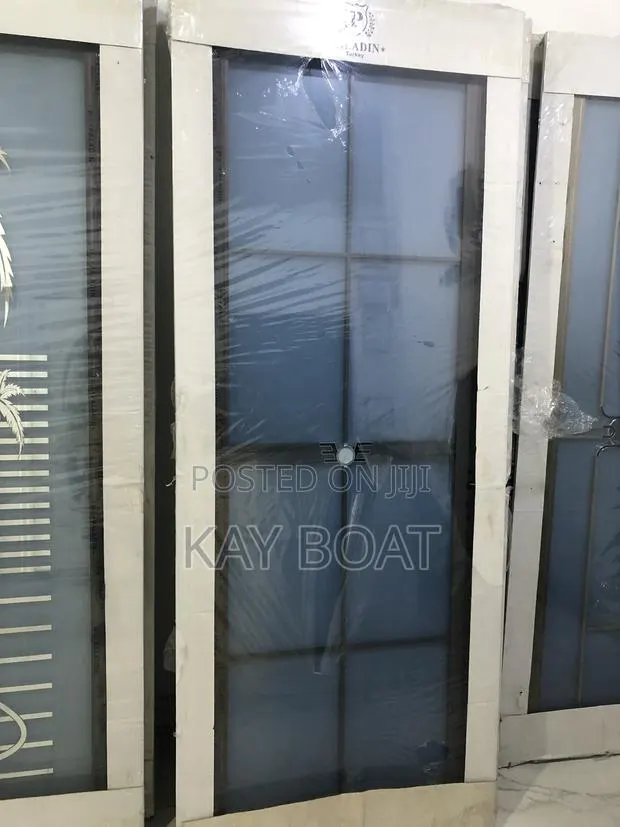 A Grey Frame Glass Door · Photo 1