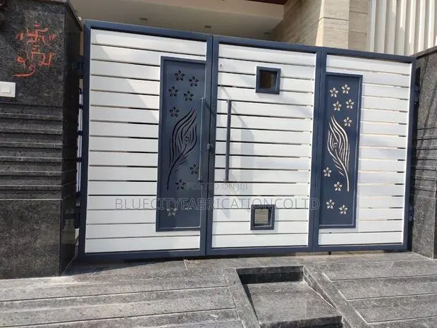 Galvanized Main Gate With Small Door Within · Photo 1