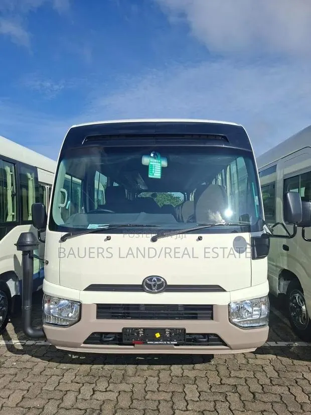 Toyota Coaster 2025 White · Photo 1