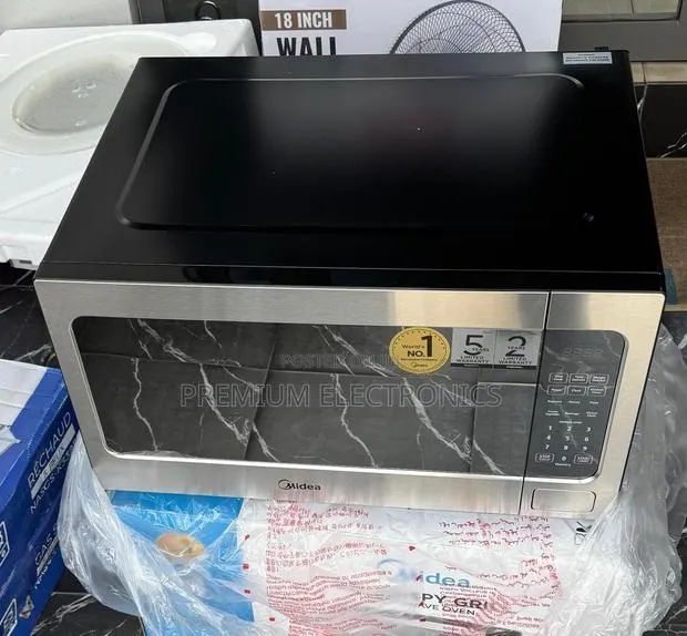 Midea 62L Solo Microwave Defrost Delay Start Function EM262AMY-S · Photo 1