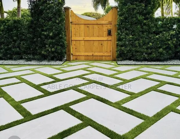 Artificial Grass and Concrete Pavers · Photo 1