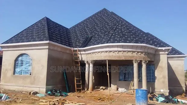 Shingle and PVC Gutter Installation · Photo 1
