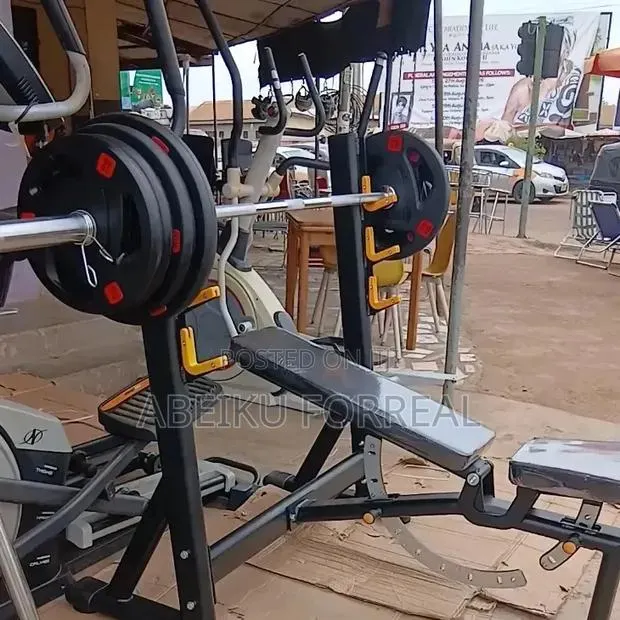 Commercial Olympic Bench + 110Kg Plates · Photo 1