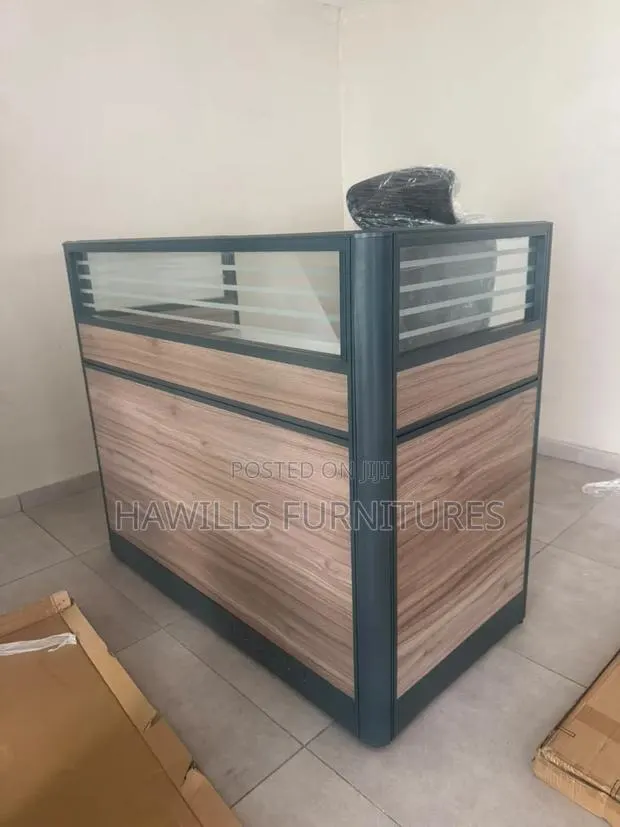 Receptionist Front Desk With a Wood Panel Finish. · Photo 1