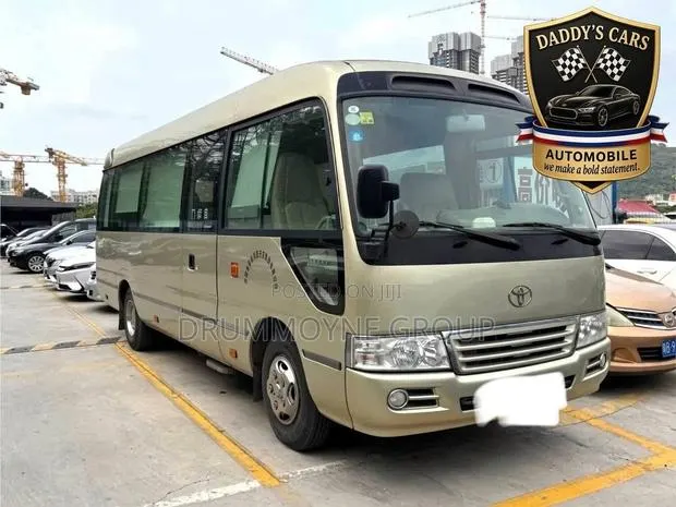 Toyota Coaster 2011 Brown · Photo 1