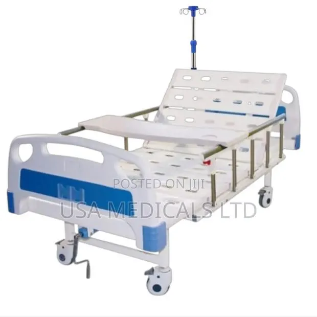 Hospital Bed With Drip Stand and Overbed Table (No Mattress) · Photo 1
