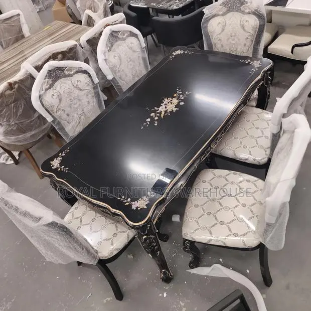 Rococo-Style Black Dining With Floral Accents and Upholstered Chairs. · Photo 1