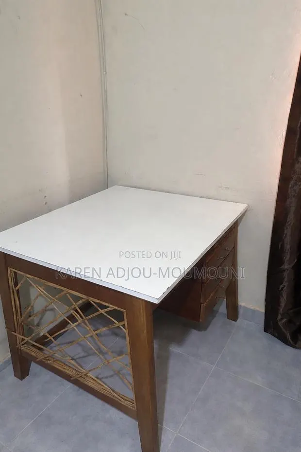 Wooden Study Desk With White Top With Its Rattan Chair