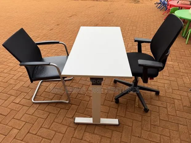 Electric Adjustable Height Table And Office Chairs · Photo 1