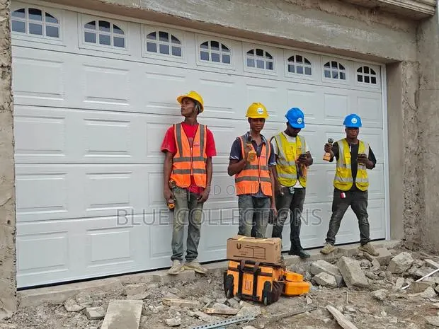 Automated Garage Door With Fanlight · Photo 1