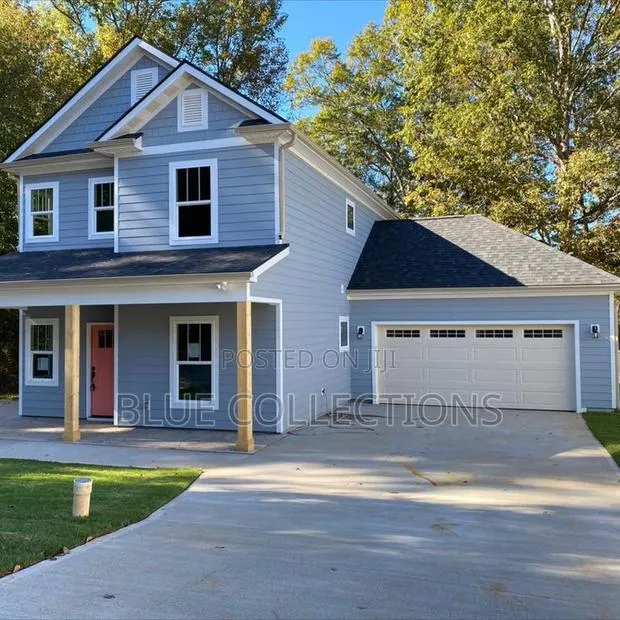 Automated Garage Door With Fanlight · Photo 1