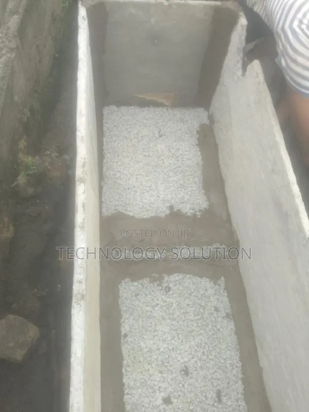 Inside Bathroom With Wc Toilet and Biodigester · Photo 1