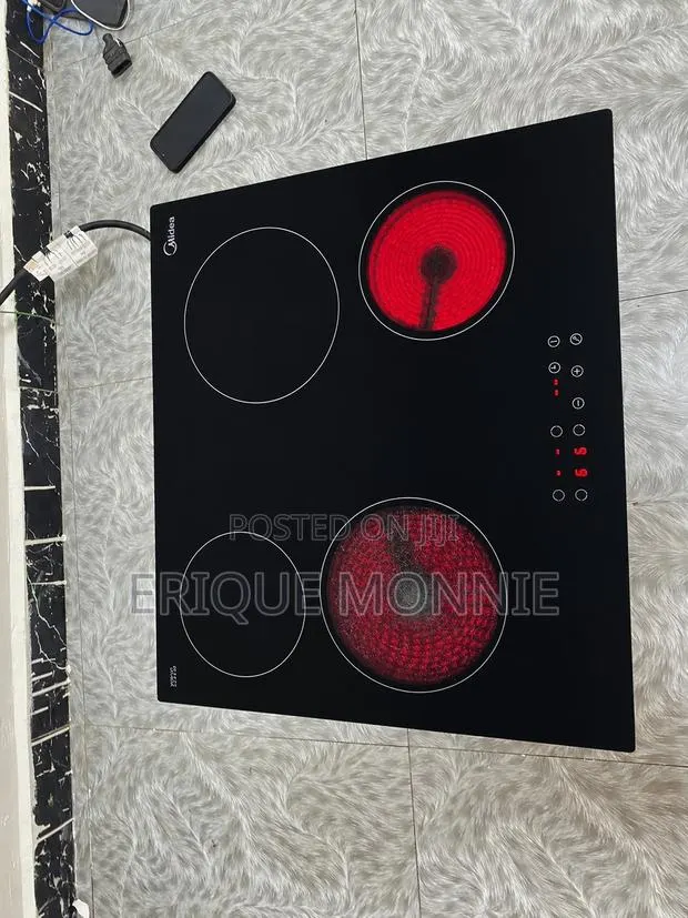 Neatly Used Electric 4 Burner Cooker. · Photo 1