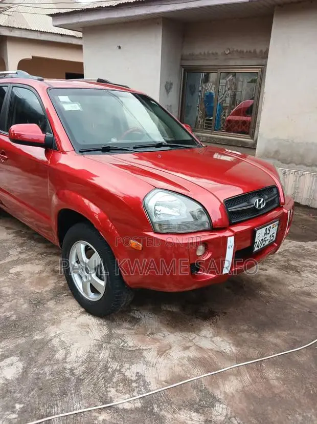 Hyundai Tucson 2009 Red · Photo 1