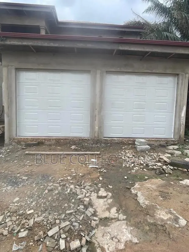 Double Panel Garage Door With Smart Opener · Photo 1