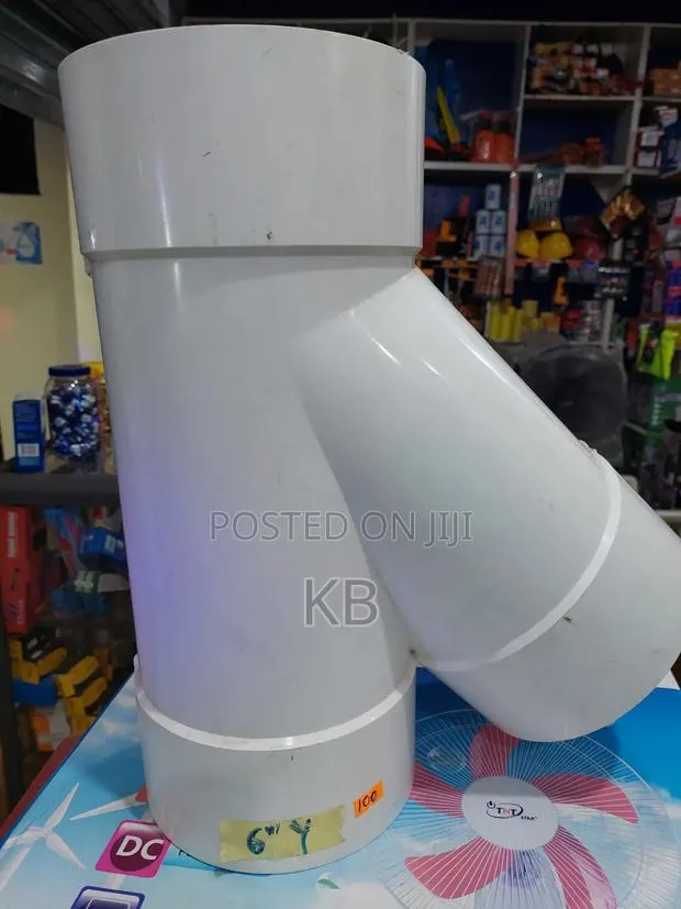 White PVC Pipe Elbow Fitting · Photo 1