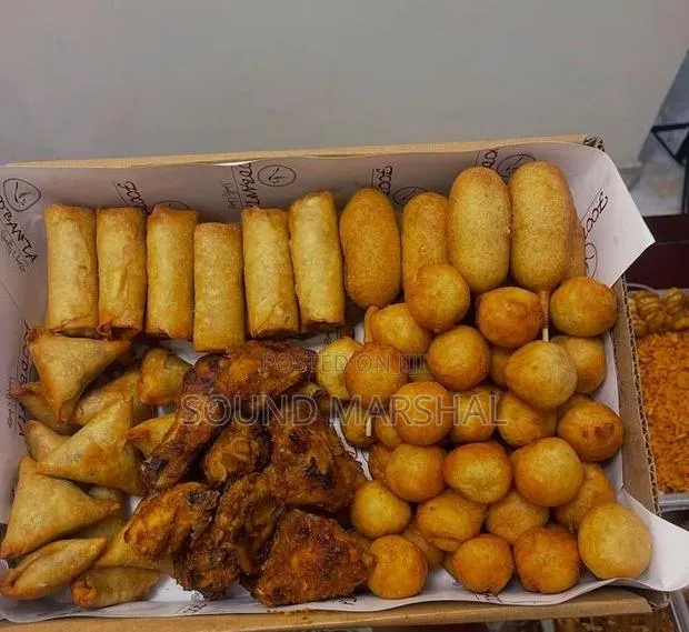 Party Snack Box – Gh₵300 | Spring Rolls, Samosas, Chicken Doughnuts · Photo 1