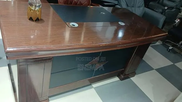 An Executive Brown and Leather Office Table · Photo 1