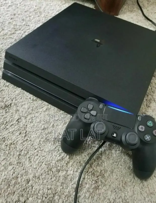 PS4 Pro With 16 Games FC27 Included · Photo 1