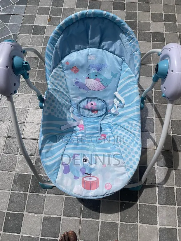 Slightly Used 2 in 1 Baby Swing, With Music and Rocker · Photo 1