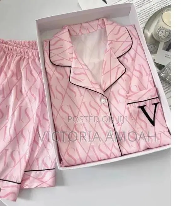 A Short-Sleeve Button-Down Pink Pajama. · Photo 1