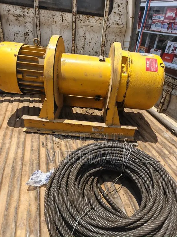 Heavy-Duty Yellow Electric Winch or Hoist Motor · Photo 1