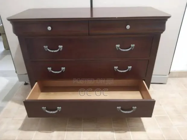 Dark Wood Dresser Features Decorative Silver Handles