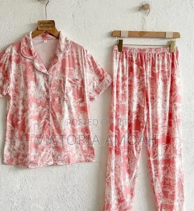 A Pink and White Printed Long- Sleeve Button- Down Pajama Set. · Photo 1