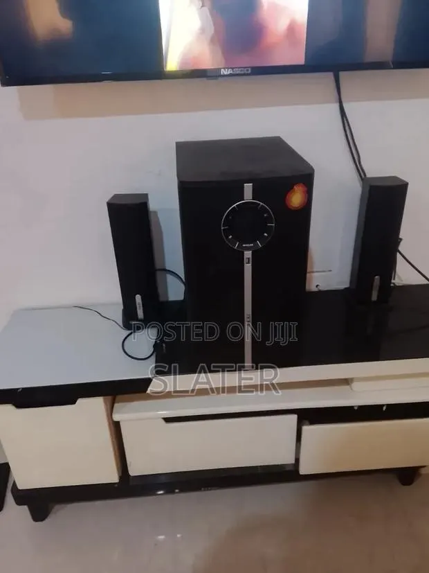 Nealy Used Adjustable TV Stand · Photo 1