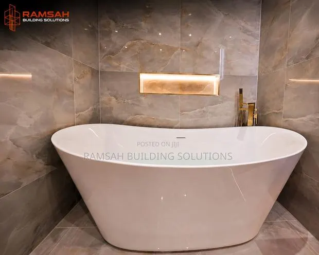 Luxury Freestanding Bathtub With Gold Mixer · Photo 1