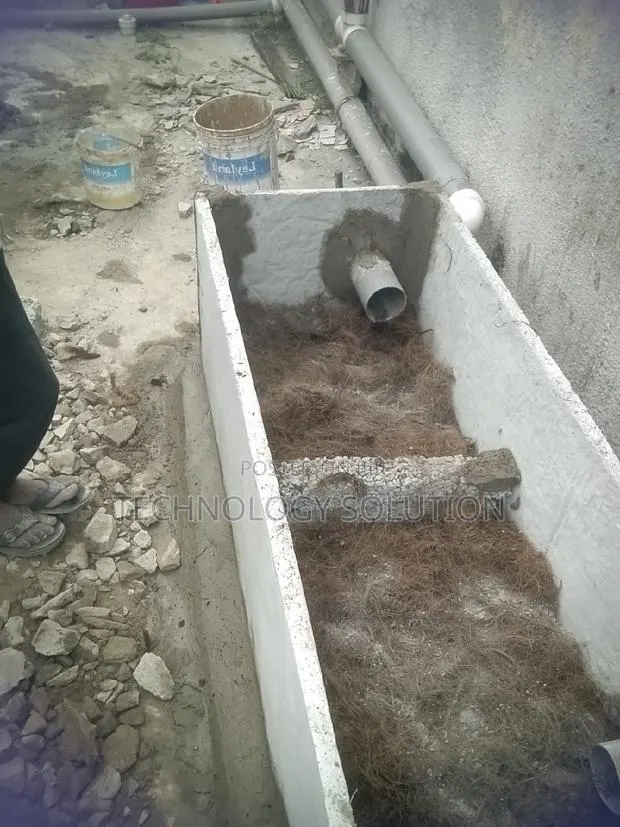 Bathroom Facility With Biodigester and Plumbing · Photo 1