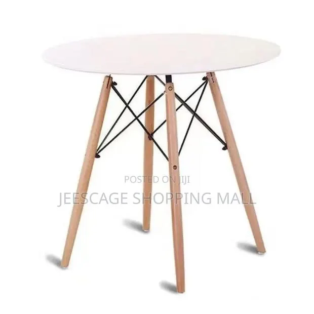 Mid-Century Modern Round Dining Table With Wood Legs · Photo 1