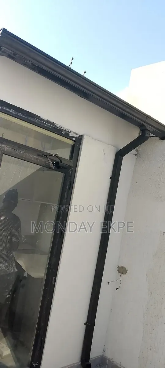 Black PVC Gutter and Pipe · Photo 1