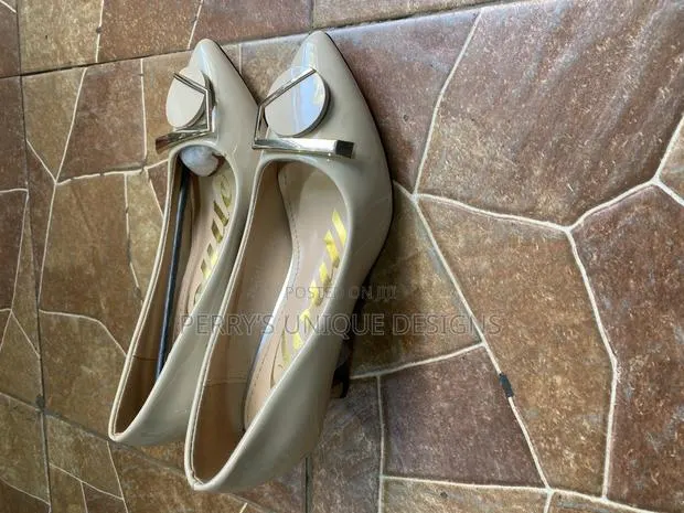 Ivory Elegance Kitten Heel Pumps · Photo 1