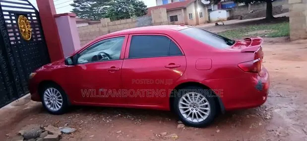 Toyota Corolla LE 4dr Sedan (1.8L 4cyl 4A) 2010 Red · Photo 1
