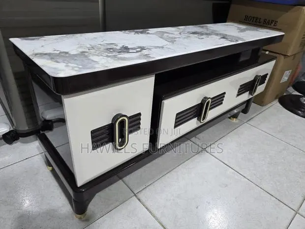 Modern Tv Stand Features White and Gray Faux Marble Top · Photo 1
