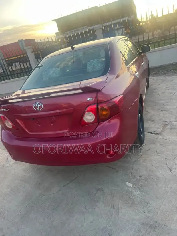 Toyota Corolla Base 4dr Sedan (1.8L 4cyl 5M) 2010 Red · Photo 1