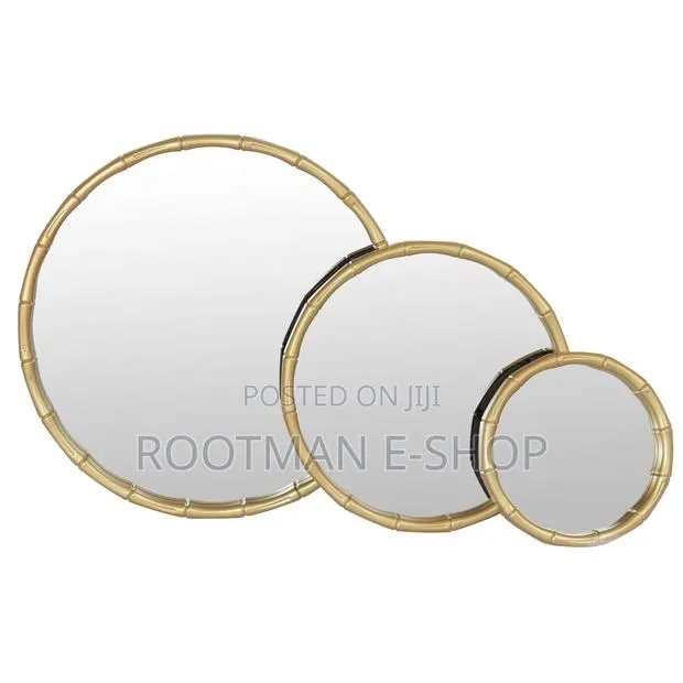 Modern Round Wall Mirrors Featuring a Gold Metal Frame · Photo 1