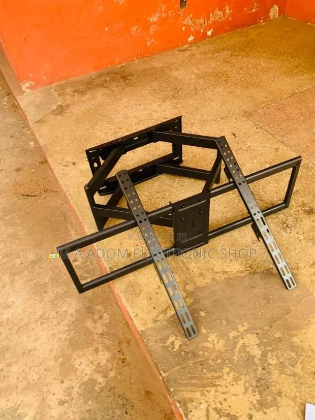 Experience the Perfect View: Adjustable TV Mount · Photo 1
